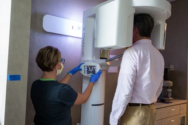 Staff using CT scanner