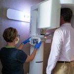 Staff using CT scanner